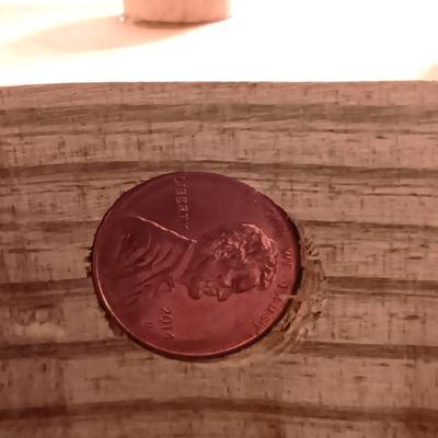 HAND CRAFTED WOODEN TOYS WITH AN EMBEDDED PENNY FOR THE YEAR THEY WERE MADE