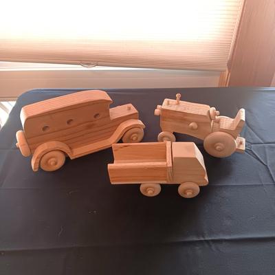 HAND CRAFTED WOODEN TOYS WITH AN EMBEDDED PENNY FOR THE YEAR THEY WERE MADE