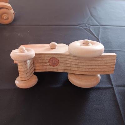 HAND CRAFTED WOODEN TOYS WITH AN EMBEDDED PENNY FOR THE YEAR THEY WERE MADE