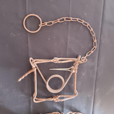 ANTIQUE COW LEG HOBBLER KICKERS AND AN OLD ANIMAL TRAP