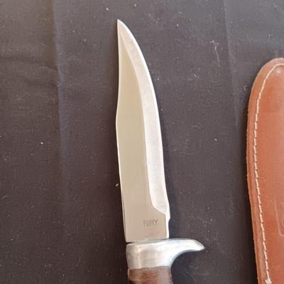 FIXED BLADE KNIFE MARKED "FURY" AND A FOLDING POCKET KNIFE BOTH HAVE SHEATHS