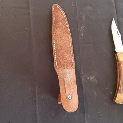 FIXED BLADE KNIFE MARKED "FURY" AND A FOLDING POCKET KNIFE BOTH HAVE SHEATHS
