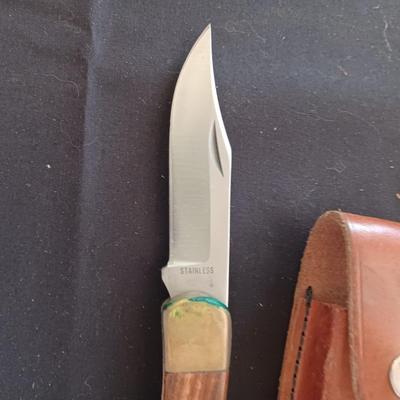 FIXED BLADE KNIFE MARKED "FURY" AND A FOLDING POCKET KNIFE BOTH HAVE SHEATHS
