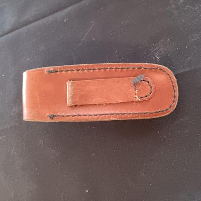 FIXED BLADE KNIFE MARKED "FURY" AND A FOLDING POCKET KNIFE BOTH HAVE SHEATHS