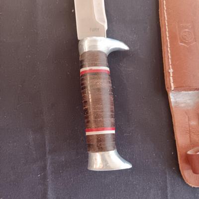 FIXED BLADE KNIFE MARKED "FURY" AND A FOLDING POCKET KNIFE BOTH HAVE SHEATHS