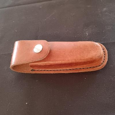 FIXED BLADE KNIFE MARKED "FURY" AND A FOLDING POCKET KNIFE BOTH HAVE SHEATHS