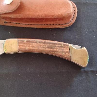 FIXED BLADE KNIFE MARKED "FURY" AND A FOLDING POCKET KNIFE BOTH HAVE SHEATHS