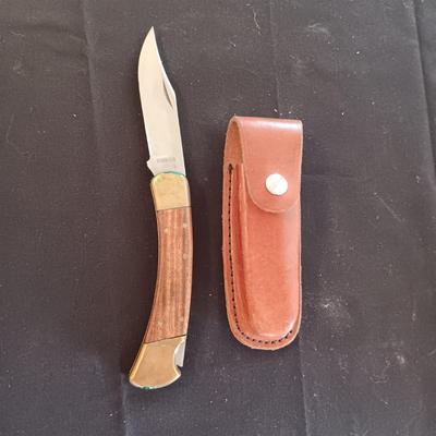 FIXED BLADE KNIFE MARKED "FURY" AND A FOLDING POCKET KNIFE BOTH HAVE SHEATHS