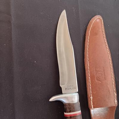 FIXED BLADE KNIFE MARKED "FURY" AND A FOLDING POCKET KNIFE BOTH HAVE SHEATHS