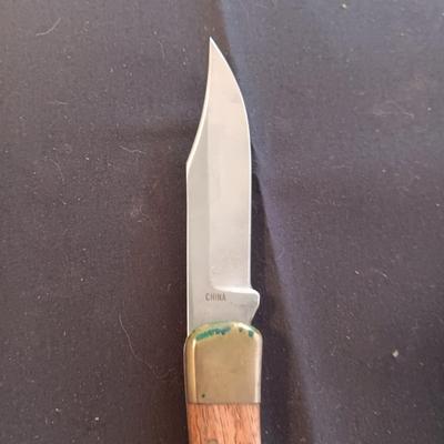 FIXED BLADE KNIFE MARKED "FURY" AND A FOLDING POCKET KNIFE BOTH HAVE SHEATHS