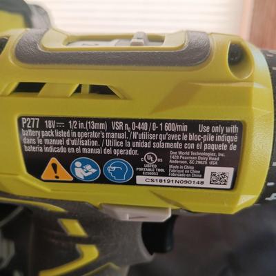 2 RYOBI CORDLESS DRILLS, 2 BATTERIES, 1 CHARGER AND A CARRY BAG