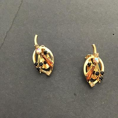 Sale Photo Thumbnail #115: Beautiful vintage, gold tone Austria signed AB rhinestone clip on earrings Please see attached photos.