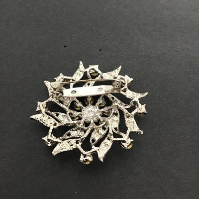 Sale Photo Thumbnail #125: Silvertone clear rhinestone brooch. Please see attached photos.