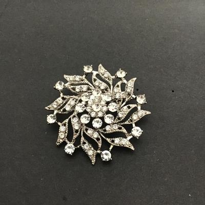 Sale Photo Thumbnail #124: Silvertone clear rhinestone brooch. Please see attached photos.