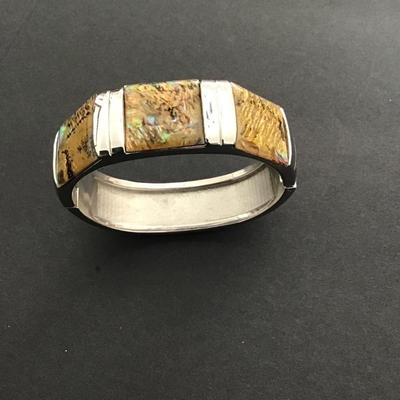 Sale Photo Thumbnail #171: Silvertone hinged bangle bracelet with honey Baltic amber inserts. Please see attached photos.