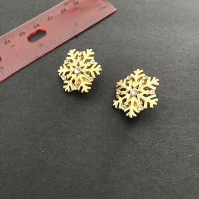 Sale Photo Thumbnail #210: Gold tone, clear, rhinestone snowflake earrings clip on’s. Please see attached photos.