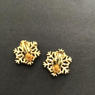 Sale Photo Thumbnail #209: Gold tone, clear, rhinestone snowflake earrings clip on’s. Please see attached photos.