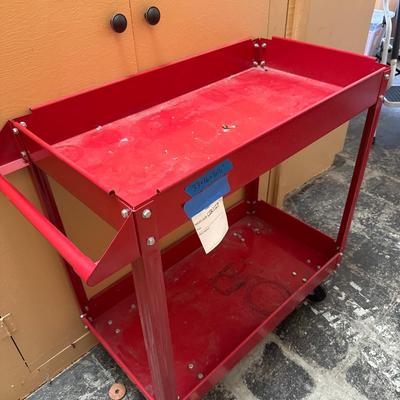 Sale Photo Thumbnail #5: Red metal cart with slight stained bottom shelf, good condition