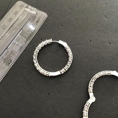 Beautiful Silvertone hinged earrings with clear rhinestone