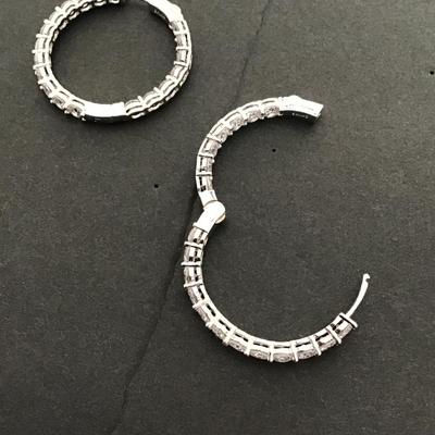 Beautiful Silvertone hinged earrings with clear rhinestone