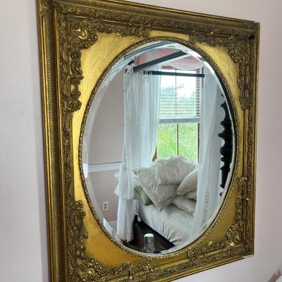 Sale Photo Thumbnail #117: Bombay Co. gold spandrel mirror; approx. 30" x 26"; overall good condition, minor loss top back right corner of frame;