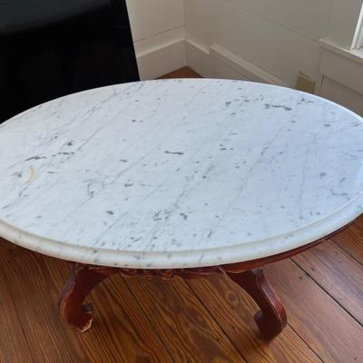 Sale Photo Thumbnail #142: Vintage Victorian-style low marble top table; approx. 17.5" x 33.5" x 22";  wear to base, crack to part of marble