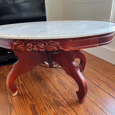 Sale Photo Thumbnail #141: Vintage Victorian-style low marble top table; approx. 17.5" x 33.5" x 22";  wear to base, crack to part of marble
