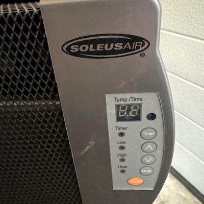 Two heaters and a tower fan