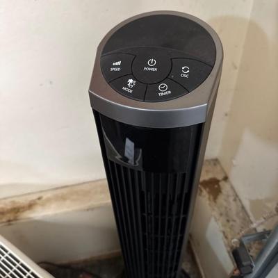 Two heaters and a tower fan