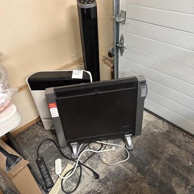 Two heaters and a tower fan