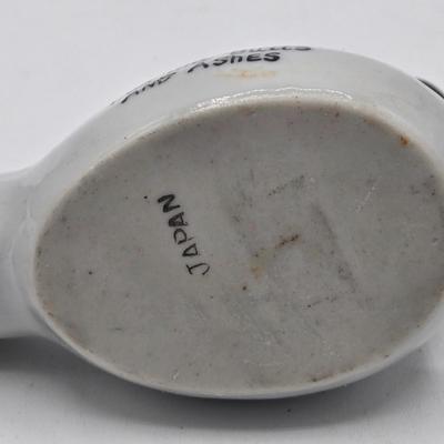 LOT 20: Vintage Silent Sam Adamson's Adventure Cartoon Character Salt Shaker, Vintage Ashtray Porcelain Baby on Bed Pan, and More