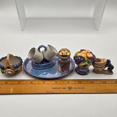 LOT 20: Vintage Silent Sam Adamson's Adventure Cartoon Character Salt Shaker, Vintage Ashtray Porcelain Baby on Bed Pan, and More