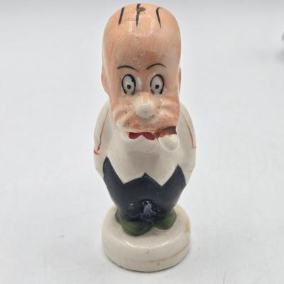 LOT 20: Vintage Silent Sam Adamson's Adventure Cartoon Character Salt Shaker, Vintage Ashtray Porcelain Baby on Bed Pan, and More