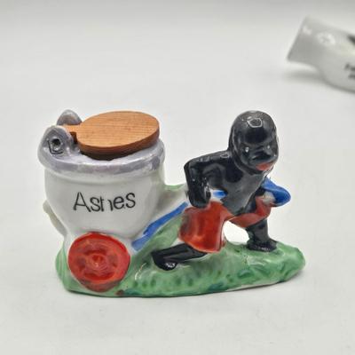 LOT 20: Vintage Silent Sam Adamson's Adventure Cartoon Character Salt Shaker, Vintage Ashtray Porcelain Baby on Bed Pan, and More