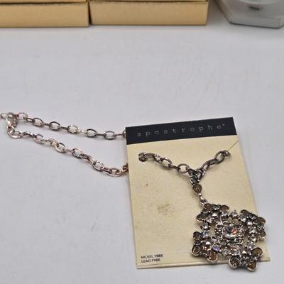 LOT 25J: Two Bracelet and Earrings Sets Made with Swarovski Elements, Liz Claiborne Black Teardrop Necklace with Matching Earrings, and More