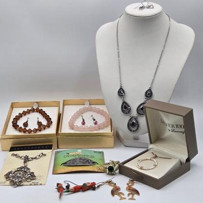 LOT 25J: Two Bracelet and Earrings Sets Made with Swarovski Elements, Liz Claiborne Black Teardrop Necklace with Matching Earrings, and More