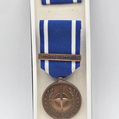 LOT 27J: Original NATO Former Yugoslavia Medal , Indianapolis 500 Pins, Avon Calling Pin, and More
