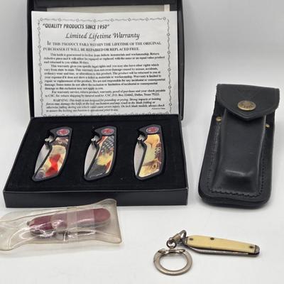 LOT 31J: NIB 3 Pocket Knives with Eagle Design, Buck Knife with Case, and More