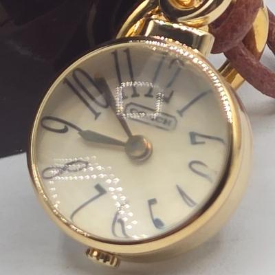 LOT 39J: Coach Pendant Watch, Kate Spade New York Wrap Folio Case for iPhone, Suede Coach iPod Case with a Heart Charm