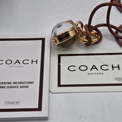 LOT 39J: Coach Pendant Watch, Kate Spade New York Wrap Folio Case for iPhone, Suede Coach iPod Case with a Heart Charm