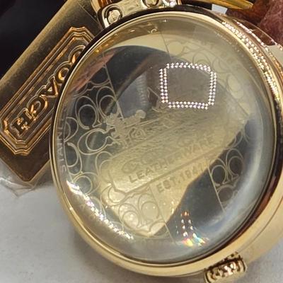 LOT 39J: Coach Pendant Watch, Kate Spade New York Wrap Folio Case for iPhone, Suede Coach iPod Case with a Heart Charm