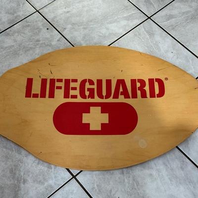 LOT 77: 25 x 7 Green Metal Exit Sign & Wood Lifeguard Wall Decor