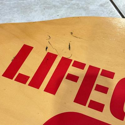 LOT 77: 25 x 7 Green Metal Exit Sign & Wood Lifeguard Wall Decor