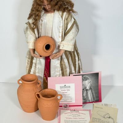 LOT 95: Jesus Water into Wine Doll by Ashton-Drake Galleries w/ Pots & COA