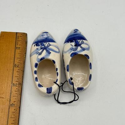 LOT 101: Porcelain Figurines: Victorian Figures, Delft Style Clogs & Windmill
