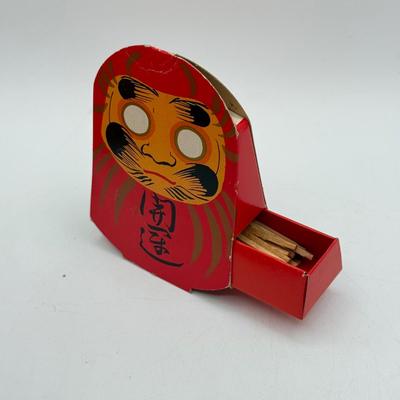 LOT 104: Dragon Topped "Robert" Stamp Set, Dharma Matchbook & Three Japanese Kokeshi Wooden Dolls