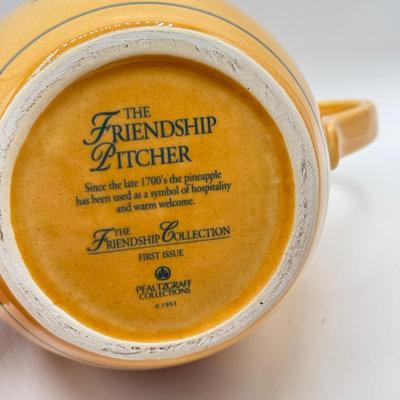 LOT 107: Pfaltzgraff Pineapple "Friendship" Pitcher & Hula Girl S&P Shakers