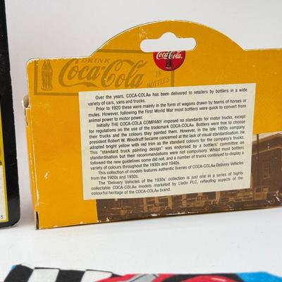 LOT 116: Coca Cola Collection: Matchbox Cars, Santa Playing Cards & NASCAR Fabric