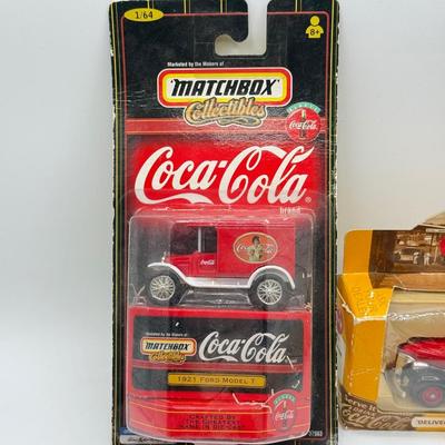 LOT 116: Coca Cola Collection: Matchbox Cars, Santa Playing Cards & NASCAR Fabric