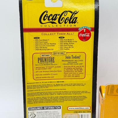 LOT 116: Coca Cola Collection: Matchbox Cars, Santa Playing Cards & NASCAR Fabric